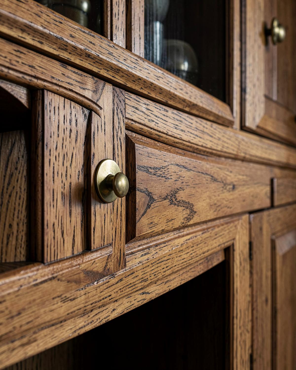 Detail of custom wood cabinetry with brass hardware